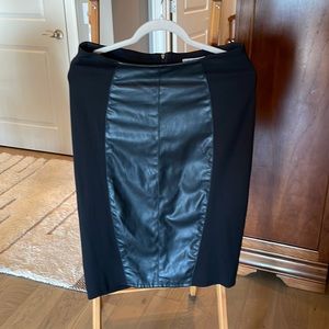 Very comfortable pencil skirt! Faux leather front panel, spandex side panels.